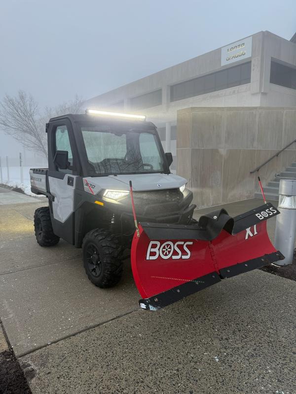 Clear Landscaping vehicle on site during whiteout conditions